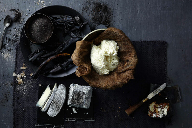 homemade salt ash, butter, and cheese on a dark background